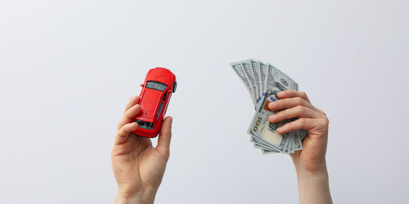Concept of car purchase and insurance with toy car